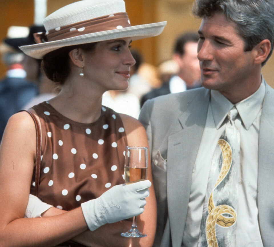 Julia Roberts med en flute med champagne i filmen 'Pretty Woman' fra 1990.