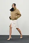 Modell viser en kort, oversized jakke med høy krage for Courrege AW 2026.